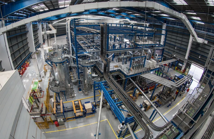 Industrial warehouse with conveyor systems and storage racks